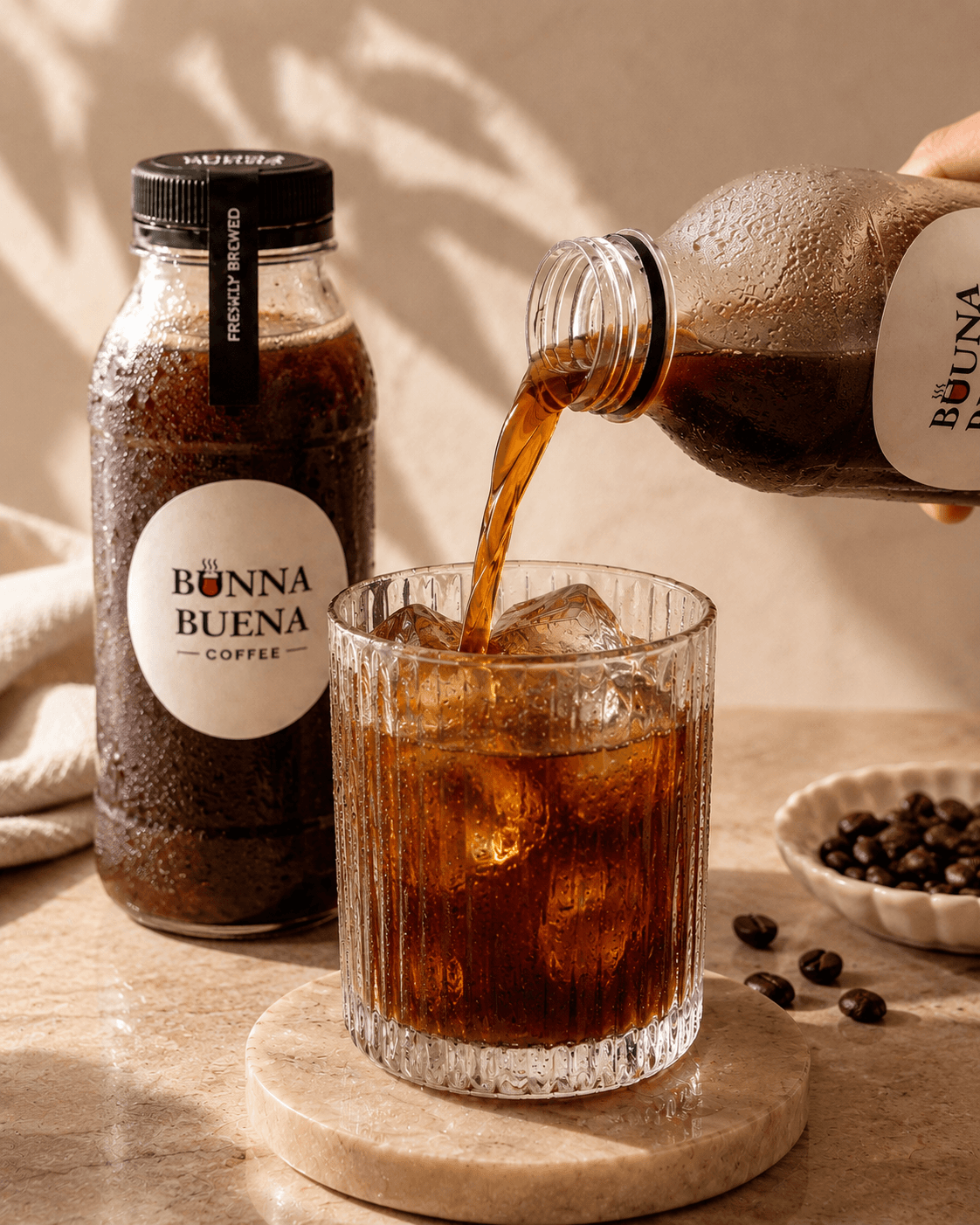 Black cold brew being poured over ice